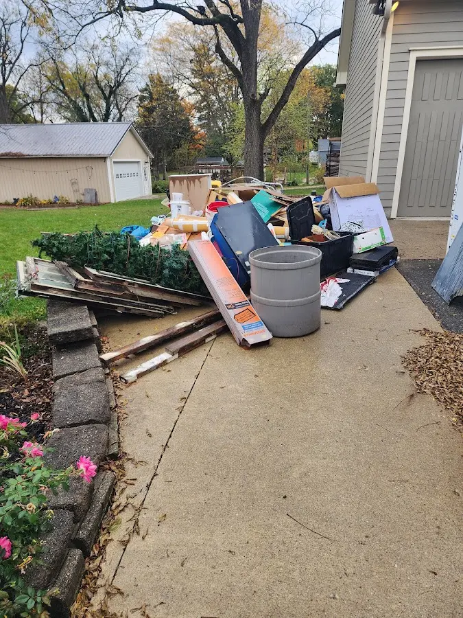 Dumpster being loaded with debris for Roofing Dumpster Rental in Giddings